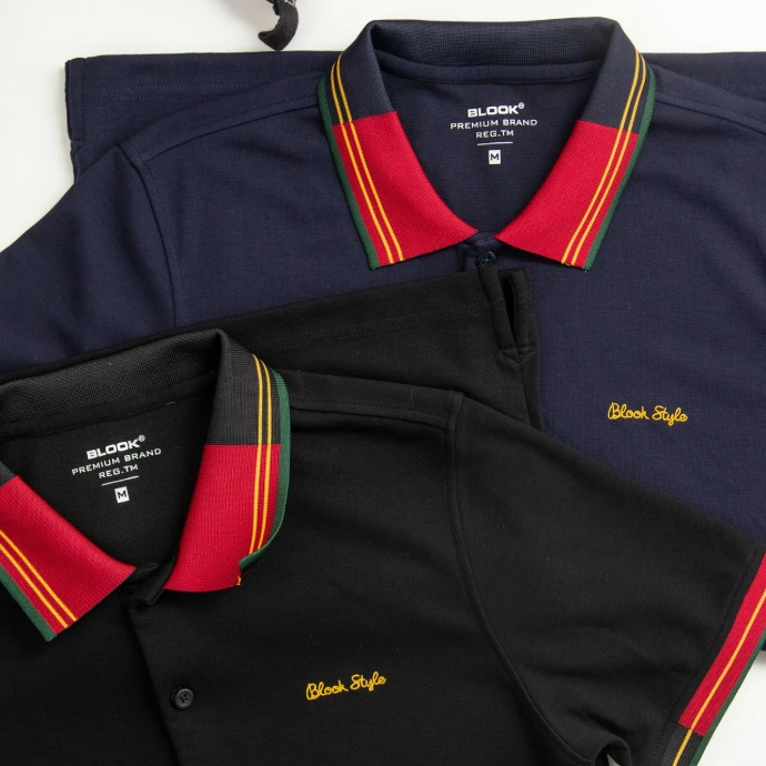 a pair of shoes and a polo shirt on a table